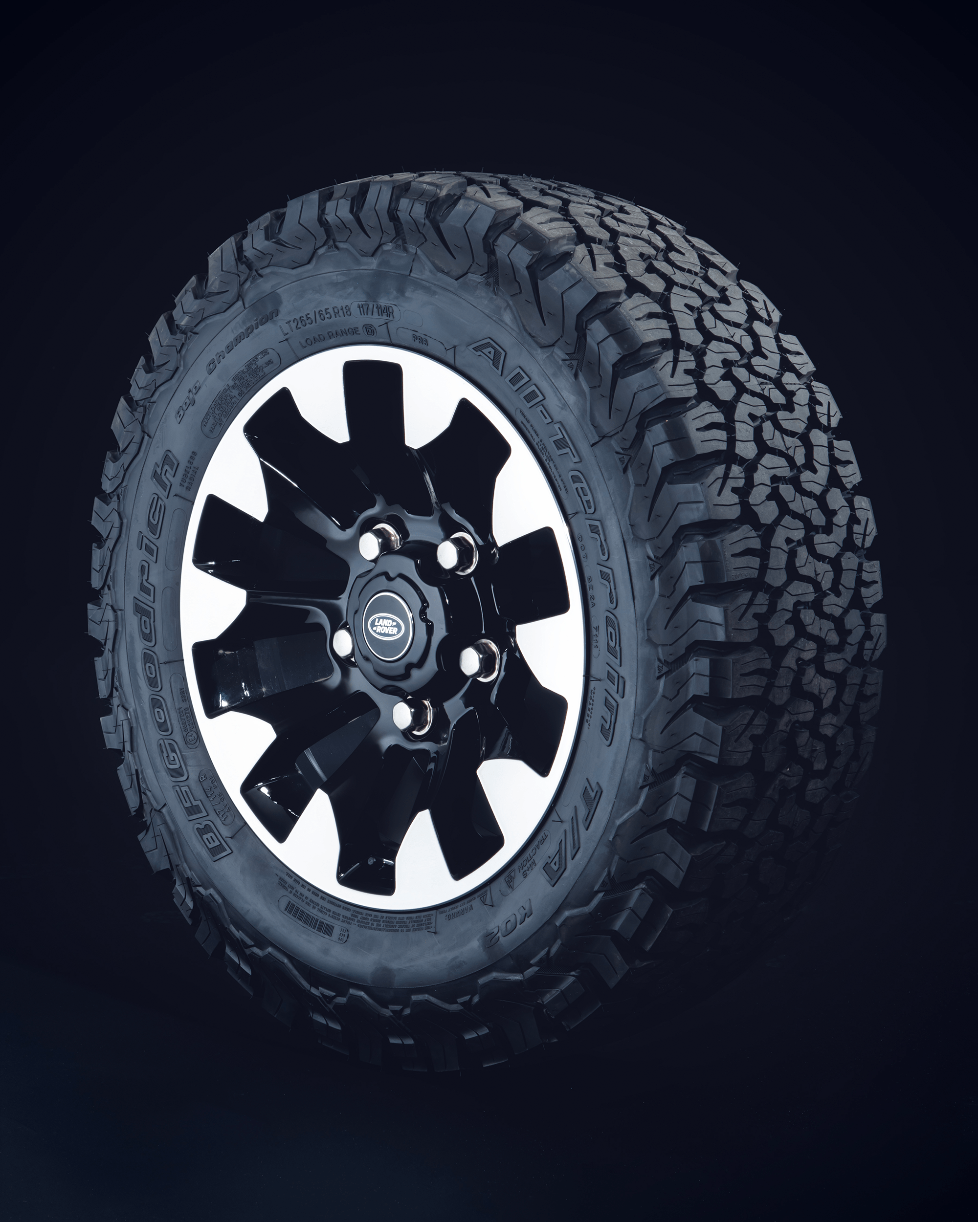 Close-up of BFGoodrich All-Terrain tyre with black and white rim.